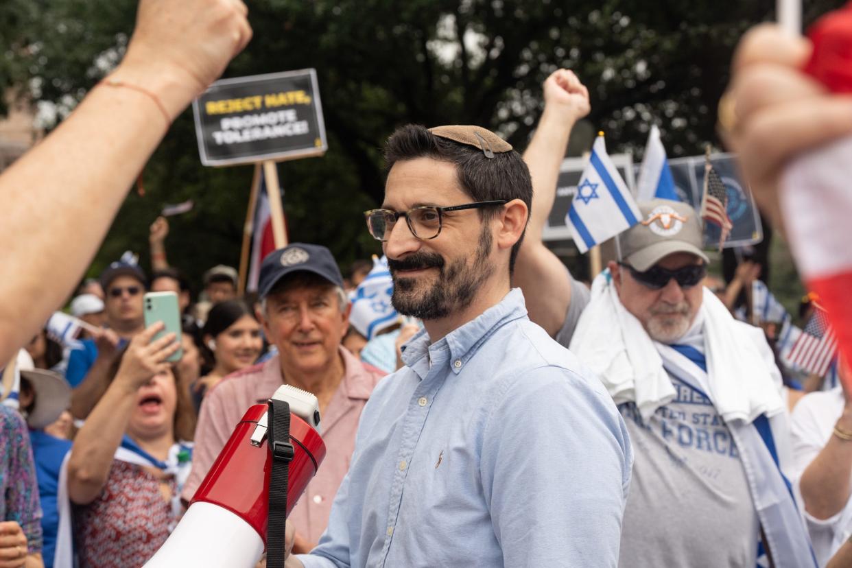 Daniel Millner, Rabi of Congregation Tiferet Israel, speaks to the crowd during a Jewish community walk in downtown Austin Sunday, May 5, 2024. The walk was held by the Israeli American Council, in Partnership with Shalom Austin, "to support Jewish college students and to raise our voices against antisemitism."