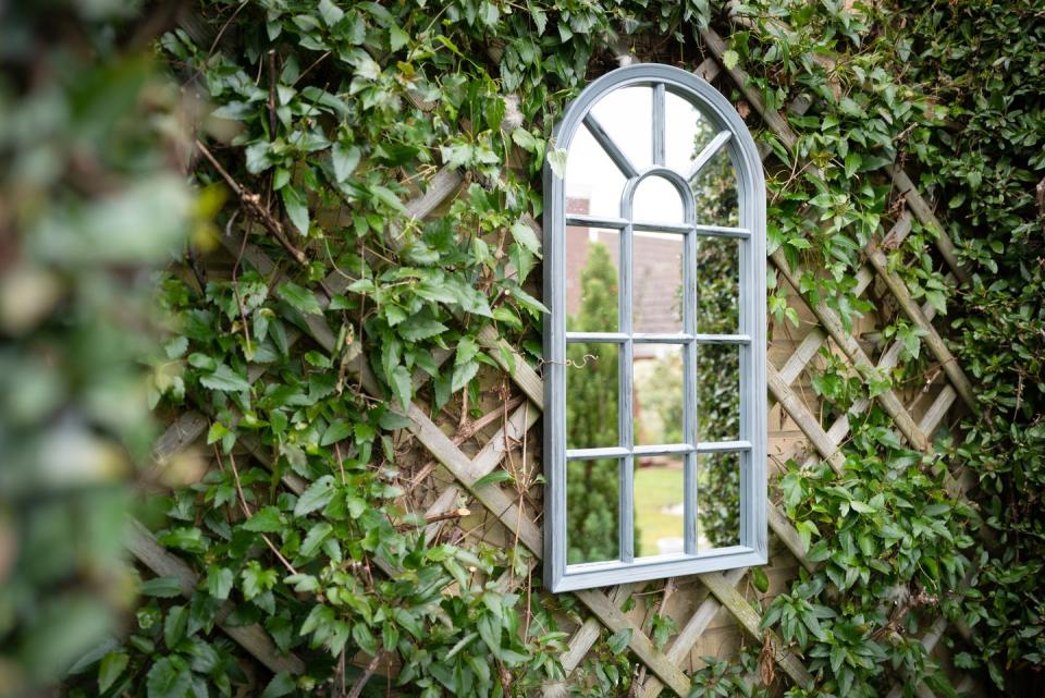 arched garden mirror