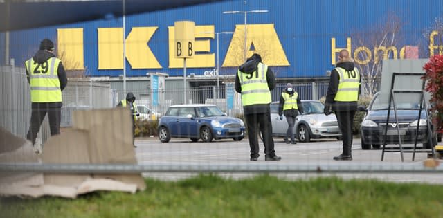 Stewards organise traffic at a Covid-19 test centre for NHS workers which has opened at Ikea's store in Wembley 