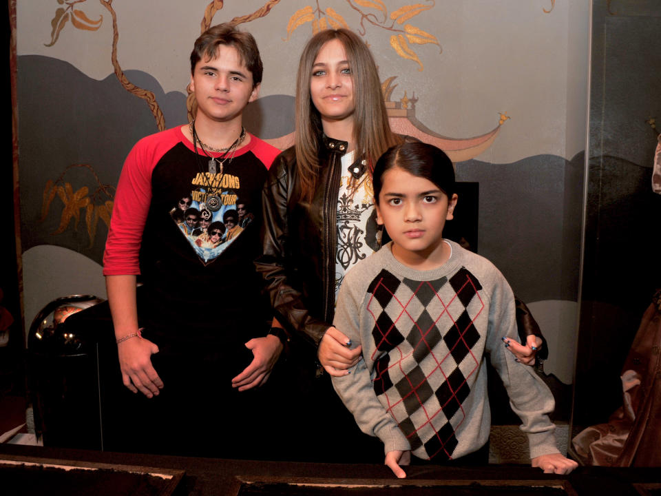 LOS ANGELES, CA - JANUARY 26:  ***EXCLUSIVE COVERAGE***  (L-R) Prince Michael Jackson, Paris Jackson, and Blanket Jackson attend the immortalization of Michael Jackson at Grauman's Chinese Theatre Hand & Footprint ceremony held at Grauman's Chinese Theatre on January 26, 2012 in Los Angeles, California.  (Photo by Lester Cohen/WireImage)