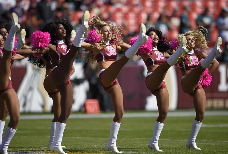 <p>Washington Redskins cheerleaders perform before an NFL football game between the Redskins and the Philadelphia Eagles, Sunday, Oct. 16, 2016, in Landover, Md. (AP Photo/Nick Wass) </p>