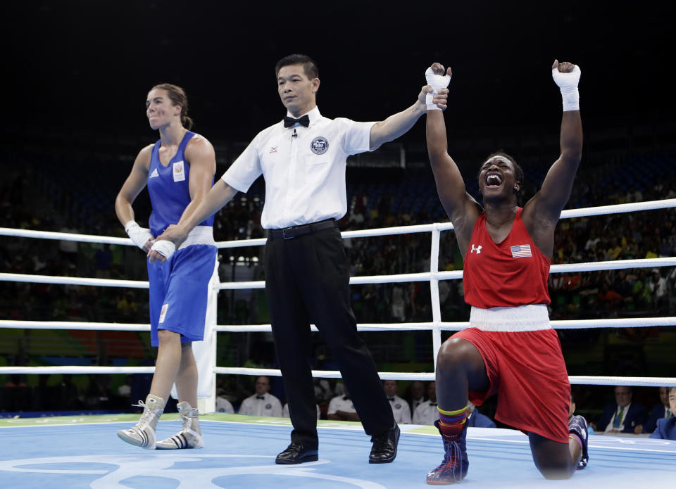 FILE - United States' Claressa Maria Shields, right, reacts as she won her gold medal for the women's middleweight 75-kg boxing against Netherlands' Nouchka Fontijn at the 2016 Summer Olympics in Rio de Janeiro, Brazil, on Aug. 21, 2016. Katie Taylor and Claressa Shields have used their Olympic success as a springboard into the pro ranks — headlining cards, selling out big arenas and garnering more media attention to help push the women's game into the mainstream. (AP Photo/Frank Franklin II, File)