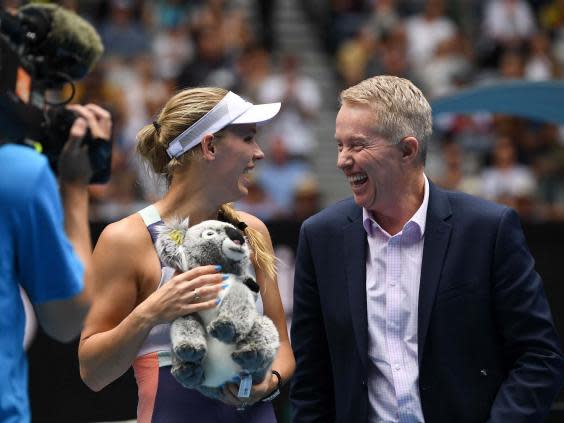 Caroline Wozniacki shares a joke with tournament director Craig Tiley (AFP)