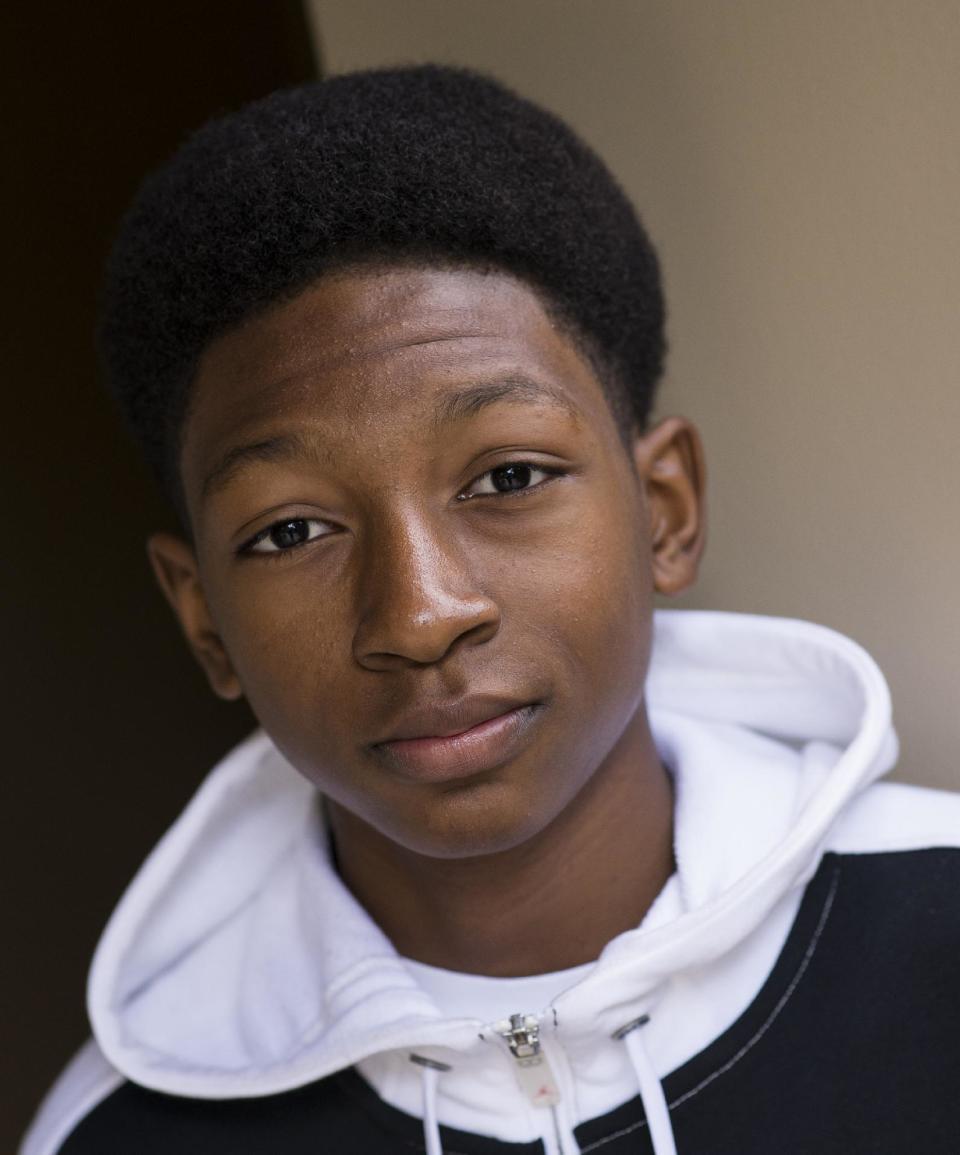 In this Monday, Oct. 7, 2013 photo, actor Skylan Brooks, from the cast of the feature film "The Inevitable Defeat of Mister & Pete," poses for a portrait at the Four Seasons Hotel, in Beverly Hills, Calif. To help stomach the eight-hour shoot days, Brooks took his younger co-star, Ethan Dizon, under his wing, helping him stay on target between takes. “We’d play games like rock, paper, scissors to keep our energy up,” Brooks describes. (Photo by Dan Steinberg/Invision/AP)