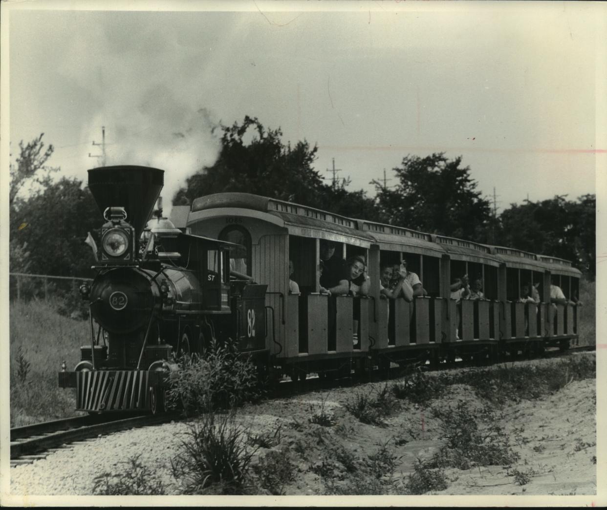 The Zoo Line, the miniature railroad at the Milwaukee County Zoo, is shown beginning its daily operating schedule June 21, 1959. The steam-engine train was donated to the zoo by The Journal Company.