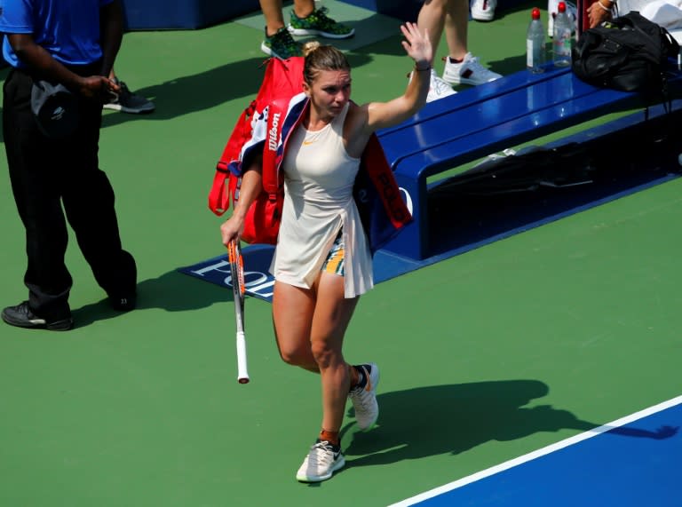 All over: Number one seed Simona Halep of Romania waves to the crowd