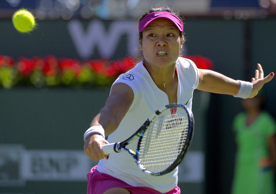 Li Na, of China, returns a volley by Karolina Pliskova, of the Czech Republic, during a third round match at the BNP Paribas Open tennis tournament, Monday, March 10, 2014 in Indian Wells, Calif. (AP Photo/Mark J. Terrill)