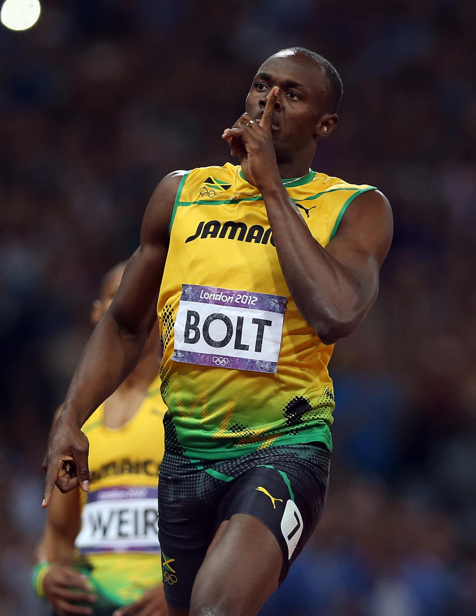 Usain Bolt of Jamaica celebrates as he crosses the finish line to win gold during the Men's 200m Final on Day 13 of the London 2012 Olympic Games at Olympic Stadium on August 9, 2012 in London, England. (Photo by Ian MacNicol/Getty Images)<br><br> <b>Related story:</b> <a href="http://yhoo.it/TmWoUx" rel="nofollow noopener" target="_blank" data-ylk="slk:Usain Bolt shushed crowd during race, did pushups after winning gold;elm:context_link;itc:0;sec:content-canvas" class="link ">Usain Bolt shushed crowd during race, did pushups after winning gold</a>