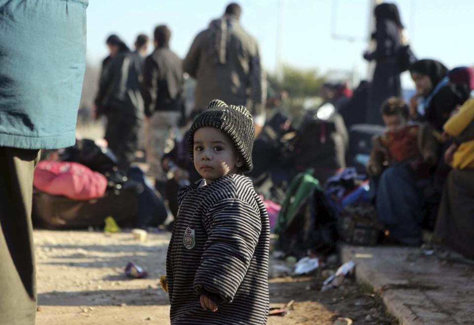 A young Syrian child evacuated from the embattled Syrian city of Aleppo during the ceasefire arrives at a refugee camp in Rashidin, near Idlib, Syria, early Monday, Dec. 19, 2016. The Security Council on Monday approved the deployment of U.N. monitors to the Syrian city of Aleppo as the evacuation of fighters and civilians from the last remaining opposition stronghold resumed after days of delays. (AP Photo)