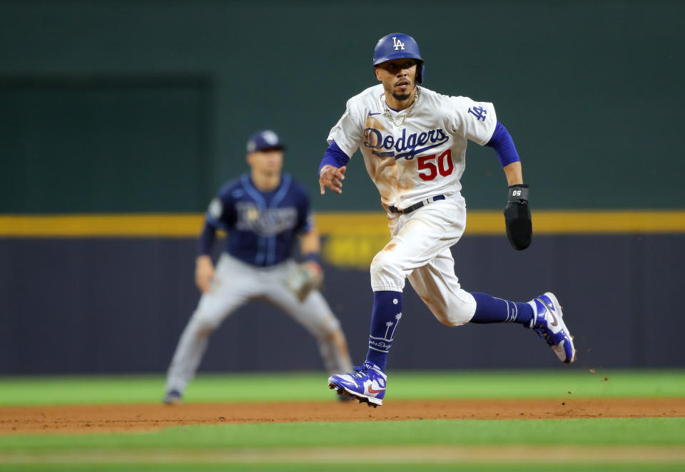 ARLINGTON, TX - OCTOBER 20: Mookie Betts #50 of the Los Angeles Dodgers steals third base in the fifth inning of Game 1 of the 2020 World Series between the Los Angeles Dodgers and the Tampa Bay Rays at Globe Life Field on Tuesday, October 20, 2020 in Arlington, Texas. (Photo by Alex Trautwig/MLB Photos via Getty Images)