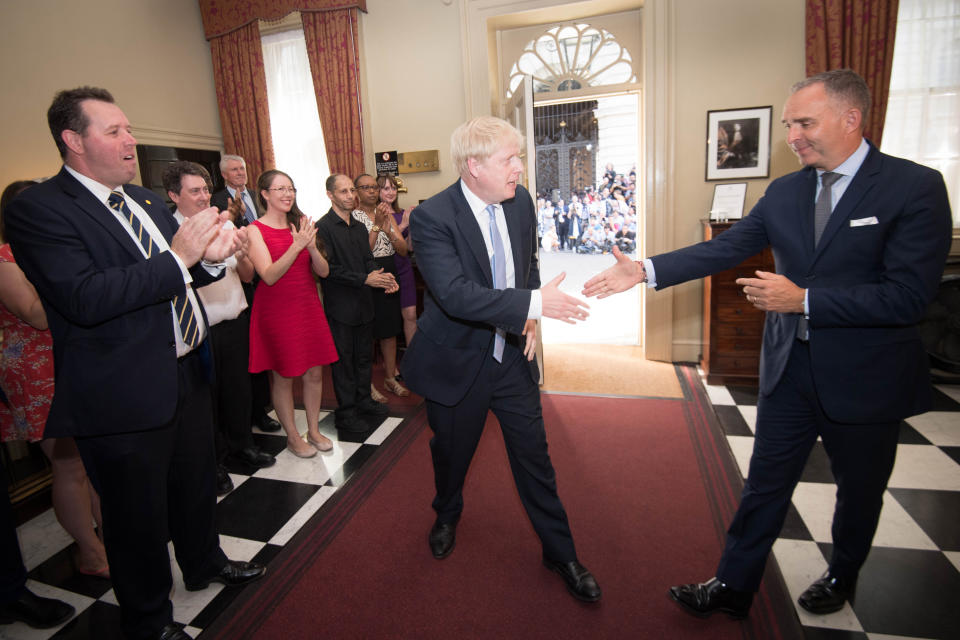 Prime Minister Boris Johnson is clapped into 10 Downing Street by staff after seeing Queen Elizabeth II and accepting her invitation to become Prime Minister and form a new government.