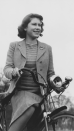 <p> During the Second World War, the royal family stayed safe at Windsor Castle where they helped with the war effort. Queen Elizabeth - then a teenage princess - was pictured riding her bike on the grounds in 1942, in between fixing and driving trucks. </p>