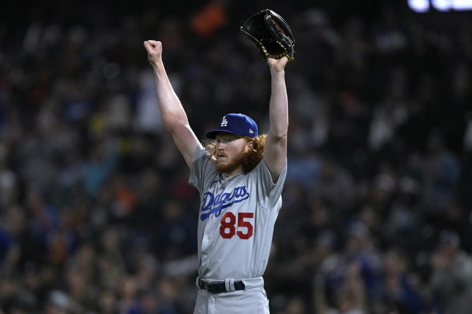 Los Angeles Dodgers pitcher Dustin May reacts after left fielder Joey Gallo made a diving catch in the outfield on a ball hit by San Francisco Giants' Joc Pederson during the first inning of a baseball game Friday, Sept. 16, 2022, in San Francisco. (AP Photo/Tony Avelar)