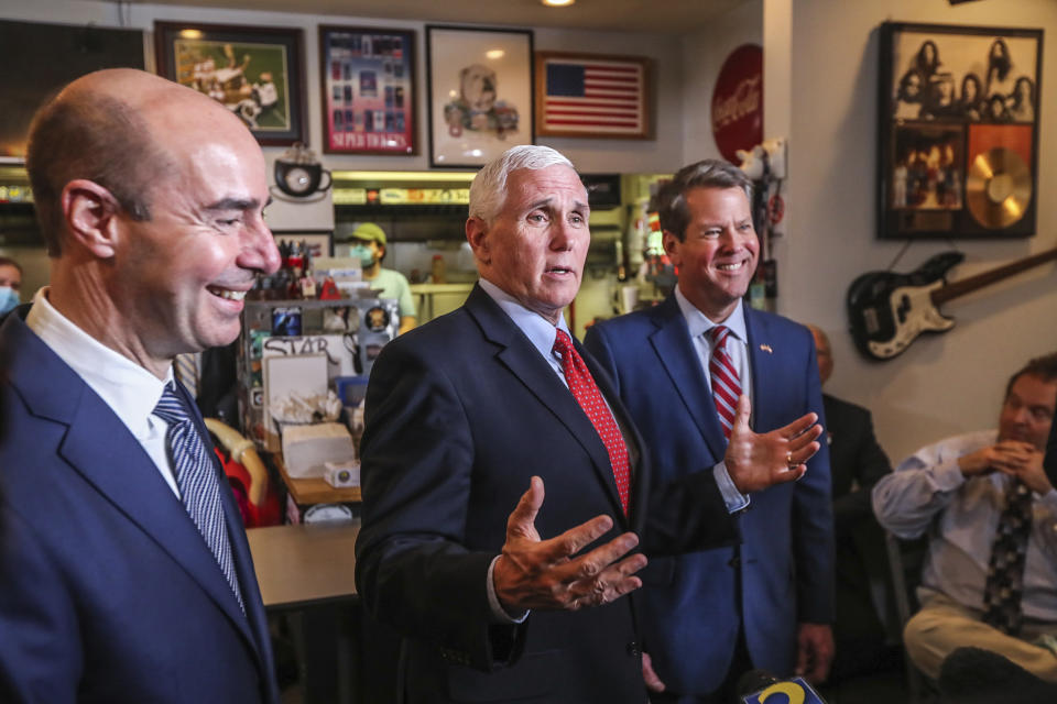 Labor Secretary Eugene Scalia, left, and Atlanta Gov. Brian Kemp join Vice President Mike Pence at the Star Cafe, Friday, May 22, 2020, in Atlanta. Pence said Georgia was "leading the way" and the country was making progress against the coronavirus. (John Spink/Atlanta Journal-Constitution via AP)