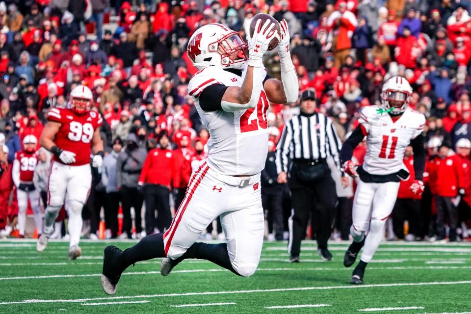 Wisconsin Badgers running back Isaac Guerendo (20) makes a 27-yard reception during the fourth quarter of the game against the Nebraska Cornhuskers on Saturday, Nov. 19, 2022, at Memorial Stadium in Lincoln, Nebraska. The Badgers scored the game-winning TD (a Graham Mertz QB sneak) on the drive.