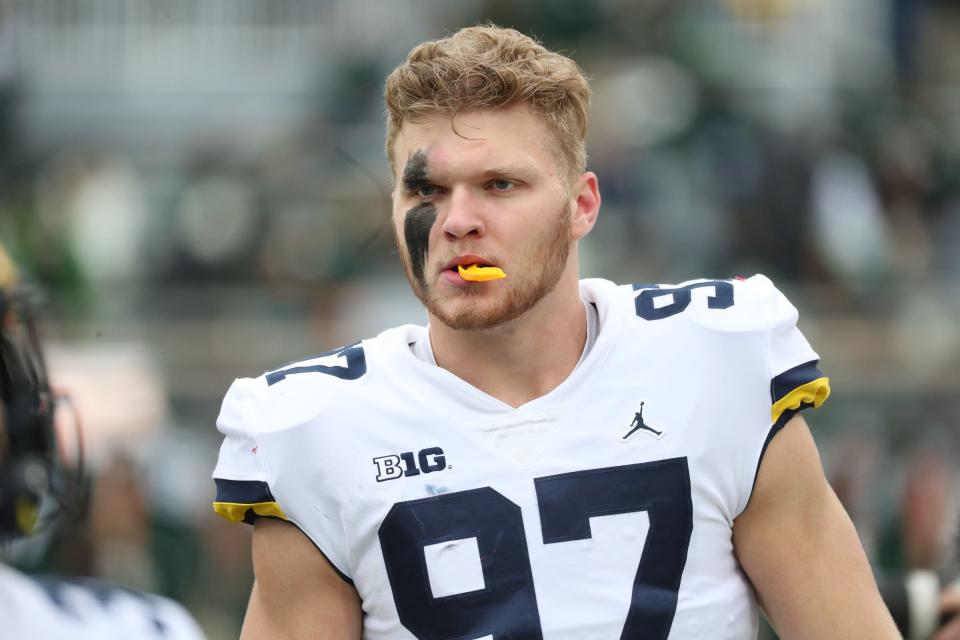 Michigan Wolverines defensive end Aidan Hutchinson (97) warms up before the game against the Michigan State Spartans, Saturday, Oct. 30, 2021.