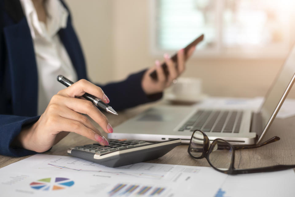 woman using a calculator