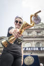 Megan Rapinoe #15 of United States holds the 2019 FIFA World Cup Trophy and stands on the steps of City Hall after getting showered by confetti after the City Hall Ceremony. Each member of the team got a key to the city after winning the 2019 FIFA World Cup Championship title, their fourth, played in France against Netherlands, at the City Hall Ceremony in the Manhattan borough of New York on July 10, 2019, USA. (Photo by Ira L. Black/Corbis via Getty Images)