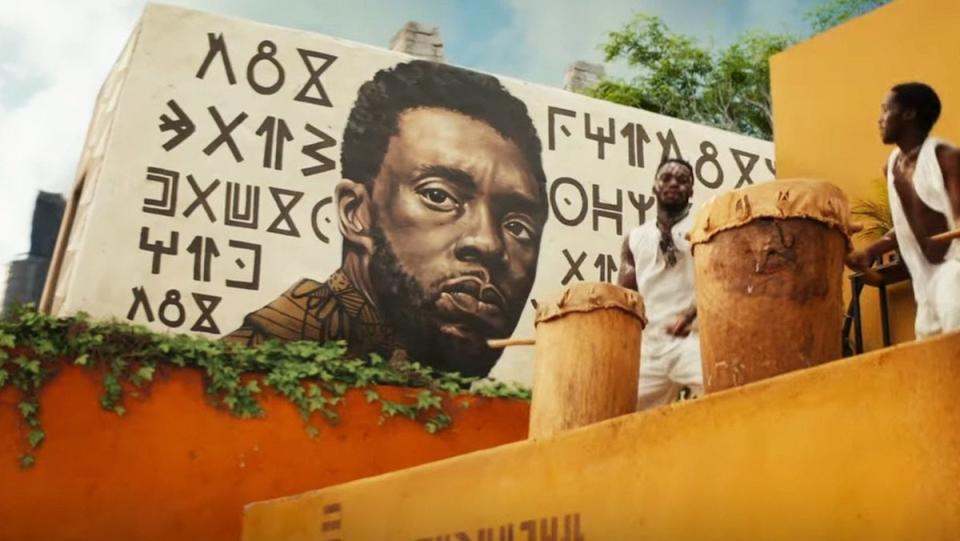 A mural of King T'Challa in Black Panther: Wakanda Forever. Black Panther Wakanda Forever mid credits scene honored T'Challa.