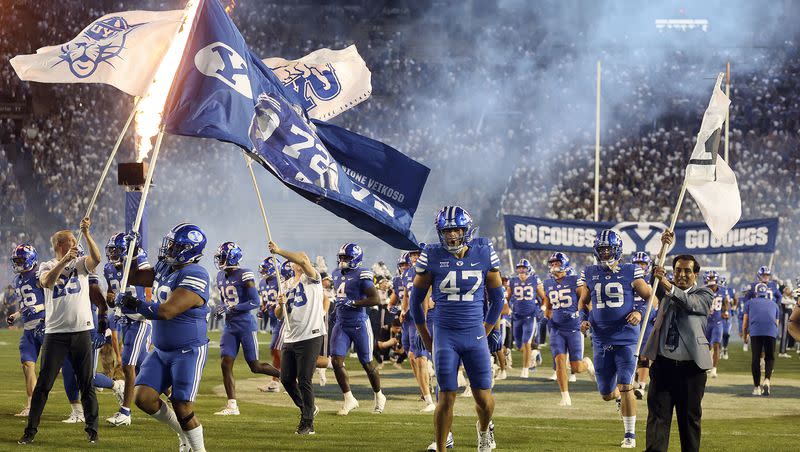The BYU Cougars enter the field to play the Cincinnati Bearcats at LaVell Edwards Stadium in Provo on Friday, Sept. 29, 2023.