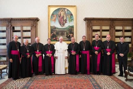 Pope Francis poses with bishops members of the Costa Rica episcopal conference at the Vatican February 13, 2017. Osservatore Romano/Handout via REUTERS