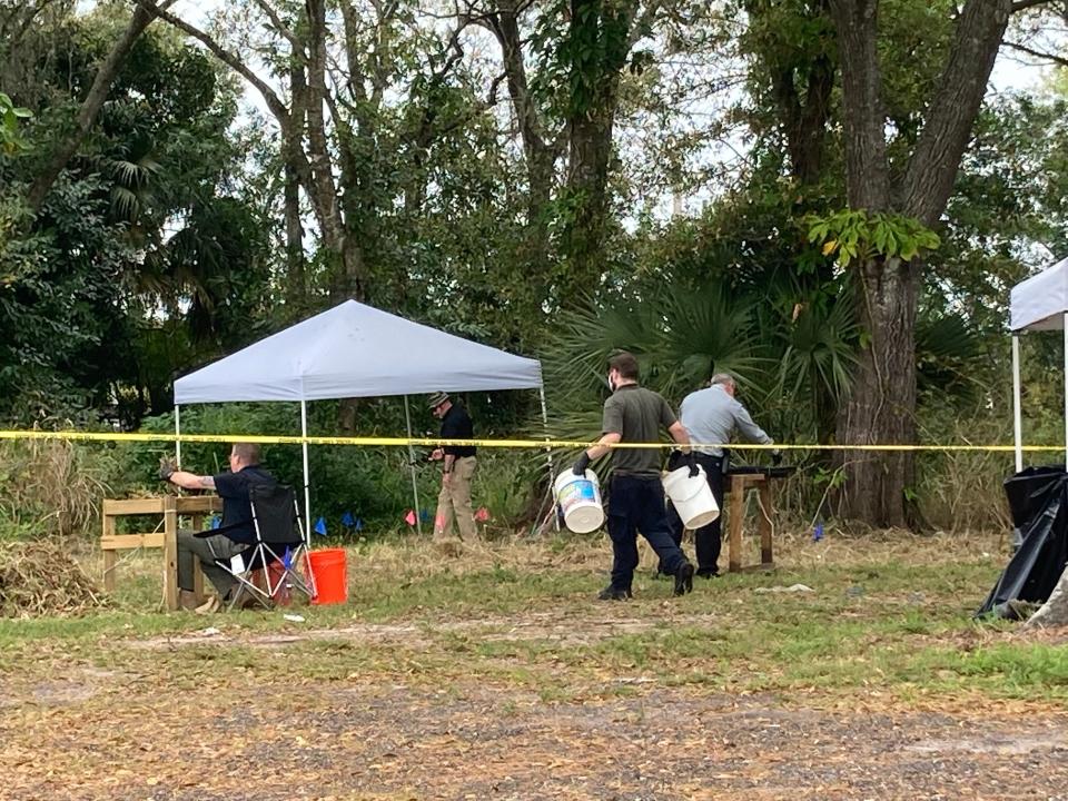 St. Lucie County Sheriff’s Office officials investigate a body found Tuesday, Jan. 11, 2022, on Totten Road.