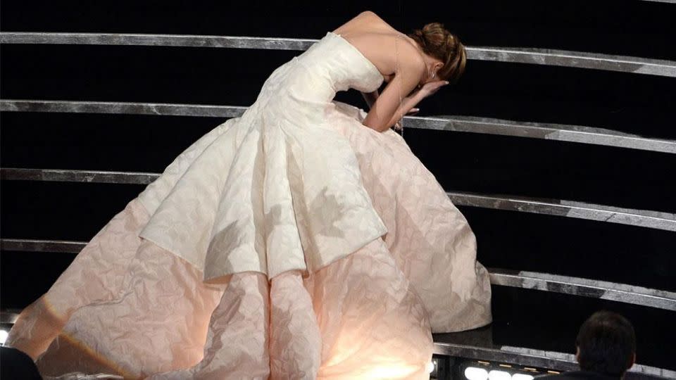 Falling in your glamorous gown when surrounded by cameras is every actress' worst nightmare,  but it's precisely what happened to JLaw in 2013. Source: Getty