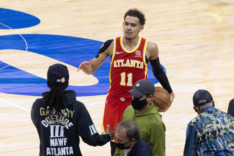 Trae Young celebrates with fans after the Atlanta Hawks' Game 5 win against the Philadelphia 76ers.