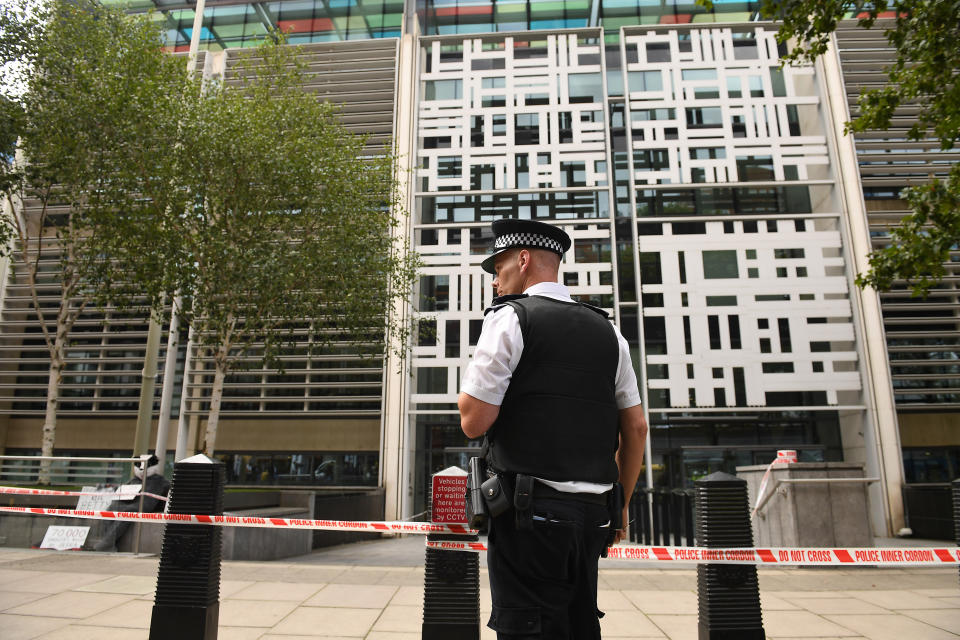 Police officers at the government building in Marsham Street in Westminster, after the shocking incident. (PA)