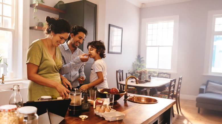 family cooking in kitchen