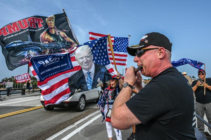 Supporters of former US President Donald Trump gather near his residence at Mar-A-Lago