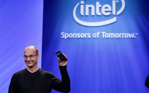 Andy Rubin, holds up a Google Android phone in 2011 - Credit: AP