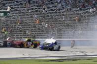 Gray Gaulding (52) and Tanner Berryhill (23) crash on the front stretch during a NASCAR Xfinity Series auto race at Texas Motor Speedway in Fort Worth, Texas, Saturday, June 12, 2021. (AP Photo/Larry Papke)