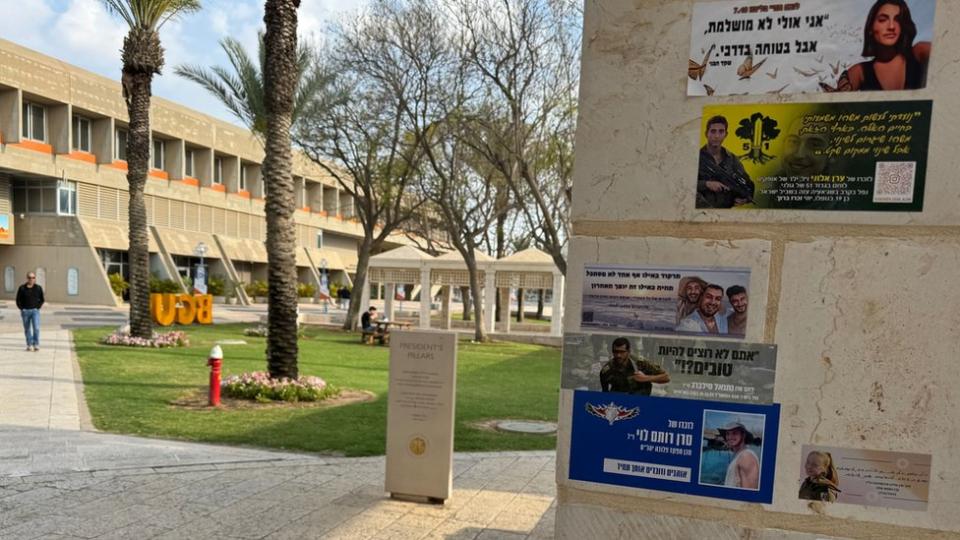 Stickers on the campus at Ben Gurion remember students killed on 7 October and in Gaza