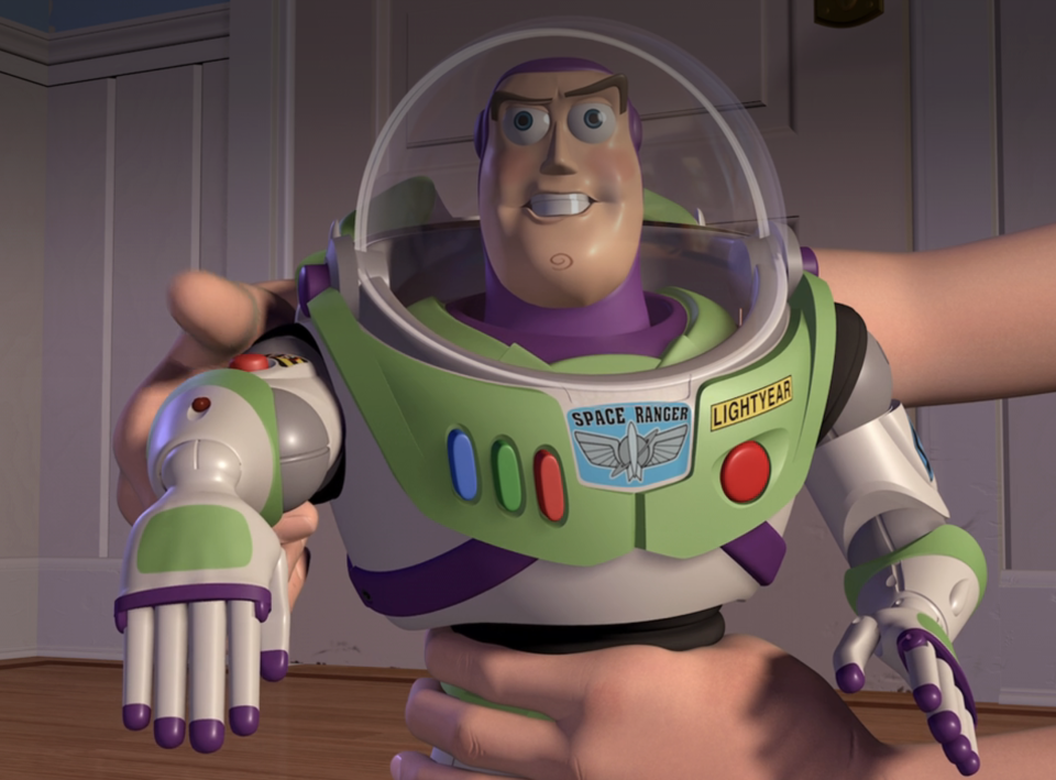 Buzz Lightyear from Toy Story staying still in Andy's hands