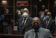 Former South African President Jacob Zuma, sits in the High Court in Pietermaritzburg, South Africa, Tuesday Oct. 26, 2021. Zuma has demanded to be acquitted of corruption charges because of the alleged abuse he has suffered at the hands of his prosecutors. He is in court facing charges of corruption, money laundering and racketeering. (AP Photo/Jerome Delay, Pool)
