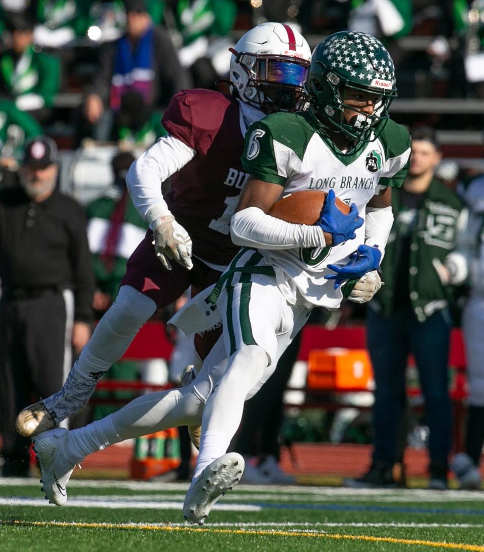 Long Branch receiver Shamar Williams scores a TD during the Green Wave's 35-28 win over Red Bank Regional on Thursday.
