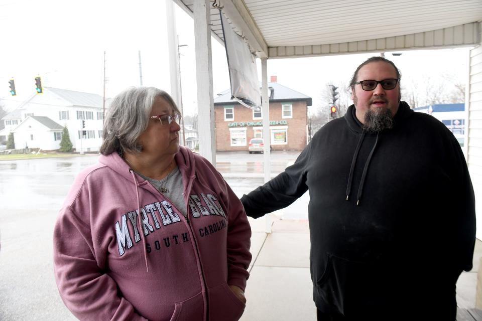 Carrie Pavkov and son, Robert Pavkov III discuss the petition which has been started for residents opposed to a proposed roundabout at the intersection of Cleveland Ave. and State St. in Greentown. Wednesday, January 24, 2024.