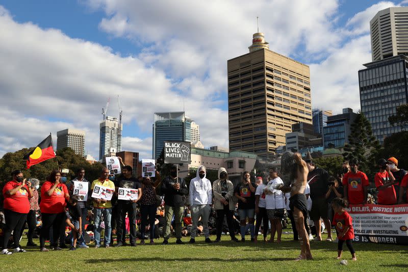 People demonstrate in solidarity with the Black Lives Matter (BLM) rallies in the United States, calling for an end to police brutality against Black people in the United States and First Nations people in Australia, in Sydney