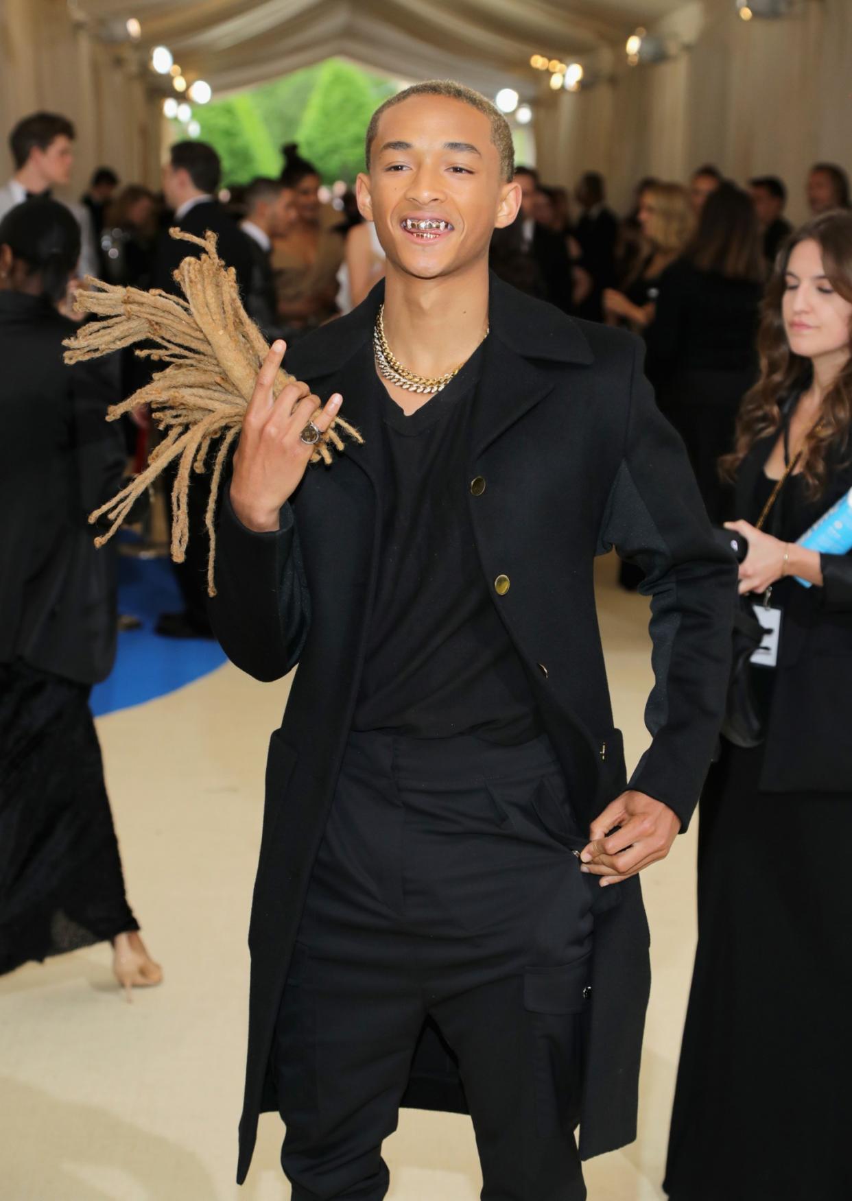 Jaden brings his signature dreadlocks as his date [Photo: Getty]