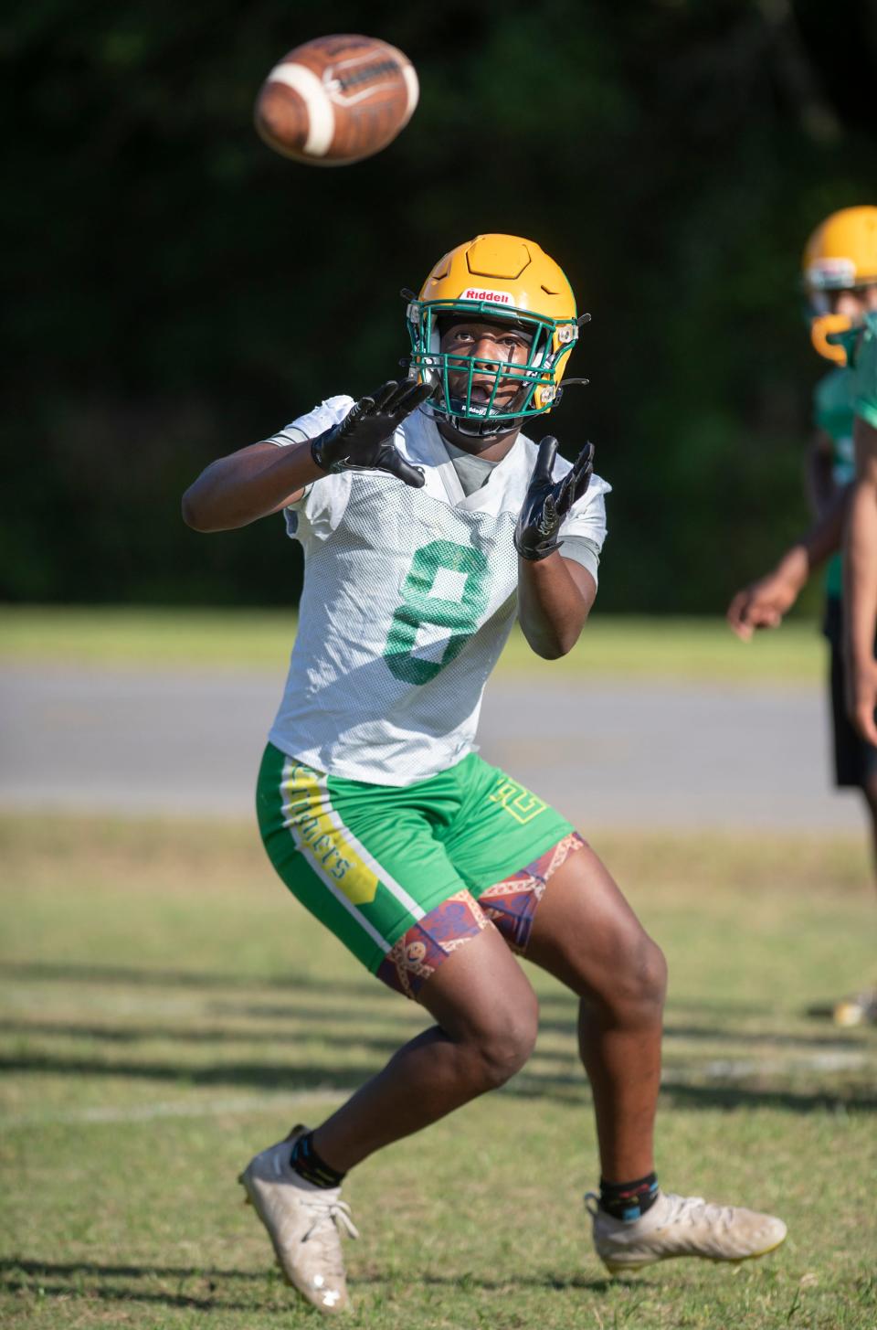 Demontrae Gaston (8) makes a catch during football practice at Pensacola Catholic High School in Pensacola on Monday, April 25, 2022.
