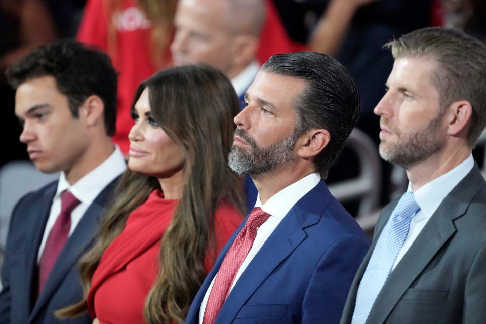 Ronan Anthony Villency, Kimberly Guilfoyle, Donald Trump Jr., and Eric Trump during the third day of the Republican National Convention at Fiserv Forum. The third day of the RNC focused on foreign policy and threats. Mandatory Credit: Jasper Colt-USA TODAY