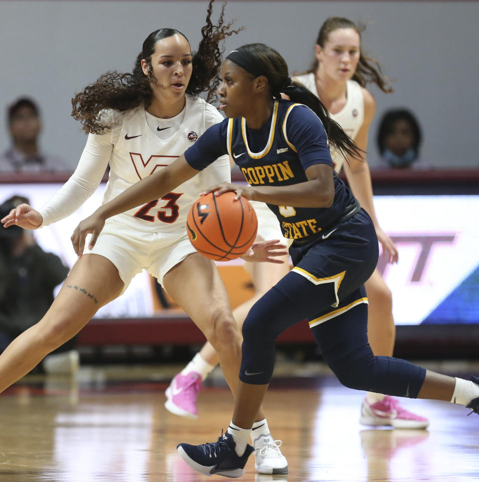 Coppin State's Aliyah Lawson (3) drives a Virginia Tech's Kayana Traylor (23) defends during in the first half of an NCAA college basketball game in Blacksburg Va., Wednesday, Nov. 17 2021. (Matt Gentry/The Roanoke Times via AP)