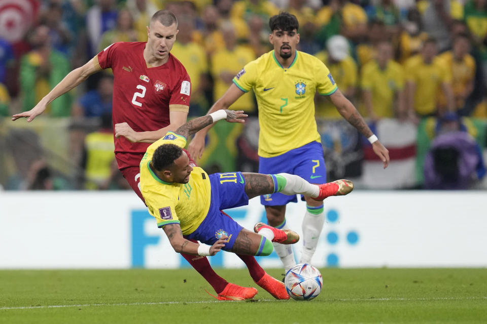 Serbia's Strahinja Pavlovic, left, challenges for the ball with Brazil's Neymar during the World Cup group G soccer match between Brazil and Serbia, at the Lusail Stadium in Lusail, Qatar, Thursday, Nov. 24, 2022. (AP Photo/Natacha Pisarenko)