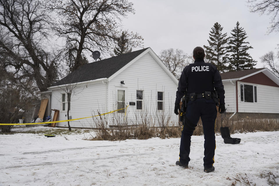 Royal Canadian Mounted Police ,RCMP, work on the scene of an ongoing investigation regarding five deaths in southern Manitoba, in Carman, Manitoba, Monday, Feb. 12, 2024. A Canadian man has been charged with five counts of first-degree murder in the deaths of his wife, three young children and a 17-year-old female relative, authorities said Monday. (David Lipnowski/The Canadian Press via AP)