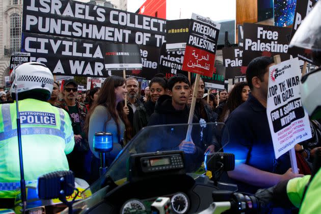 Police motorcyclists try to get through the crowd of protesters during a pro Palestinian demonstration