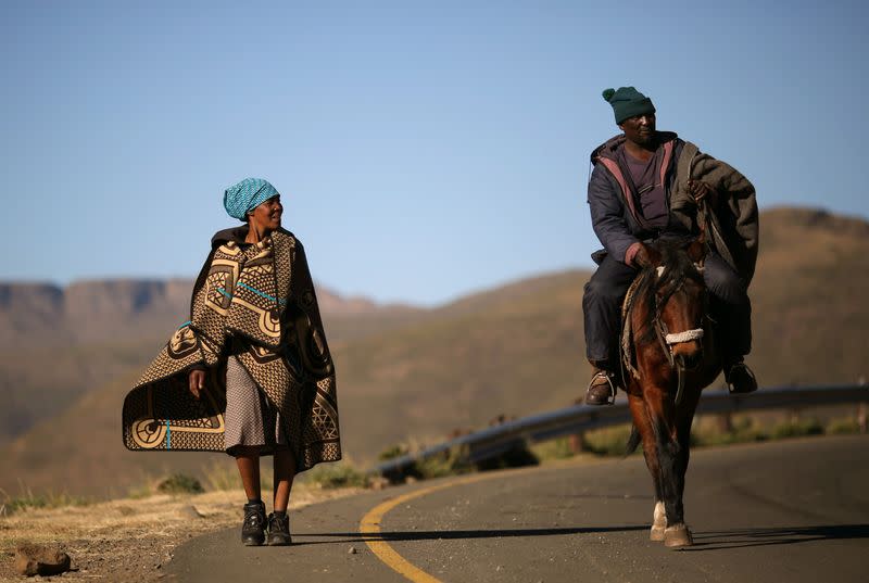 Couple return from voting during national elections at Ha Motjatji Village outside Maseru