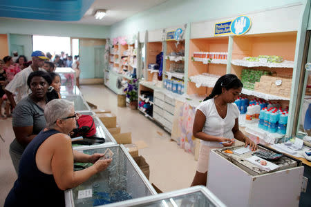 People buy goods in a state store in downtown Havana, Cuba, May 10, 2019. REUTERS/Alexandre Meneghini