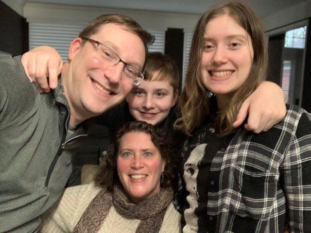 Abby Maisel, right, with her mom, Jennifer, and dad, John, and brother, Jack, at home in Lake Orion on May 6, 2021. Abby is an artist in 12th grade at Lake Orion whose artwork has touched the hearts of Oxford after the Nov. 30, 2021 shootings.