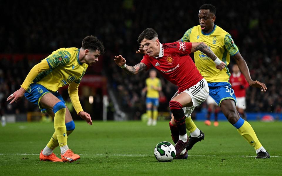 Nottingham Forest's Welsh defender Neco Williams (L) vies with Manchester United's Argentinian midfielder Alejandro Garnacho - AFP